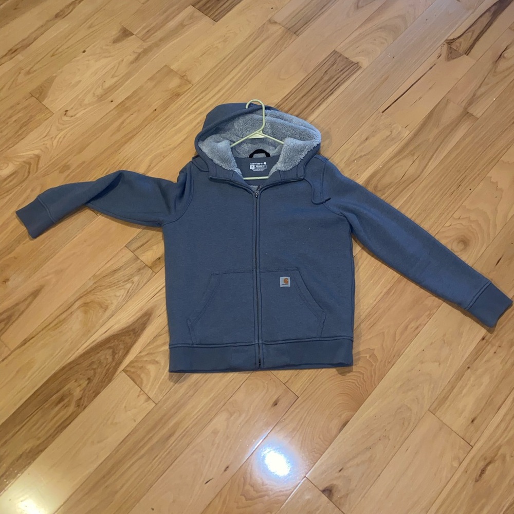 Blue zip up carhart sweatshirt